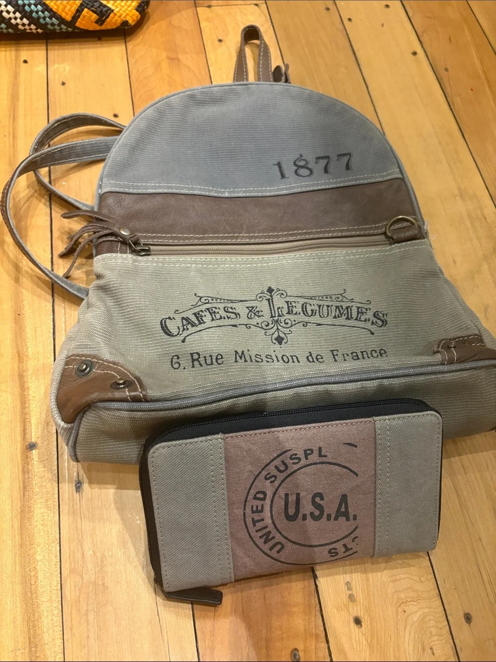 Vintage-Inspired Beige Canvas Backpack with Brown Accents - 1877 Print